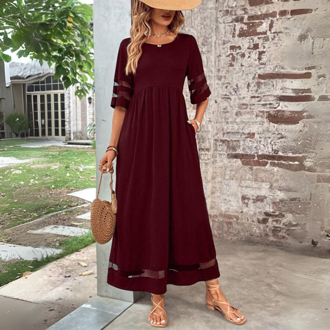 Tummy-smoothing midi dress featuring an empire waist and flowing skirt, designed for women with long sleeves in a classic white color. 4