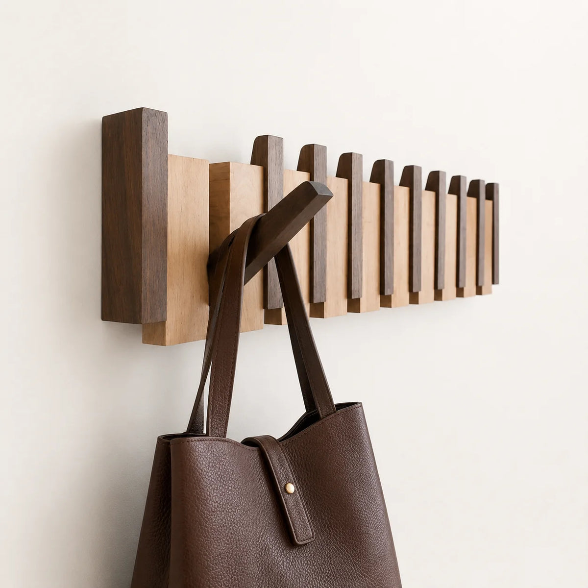 Wall mounted coat rack with foldable hooks in a modern wooden design featuring a natural finish, ideal for organizing coats and accessories in entryways or hallways 0