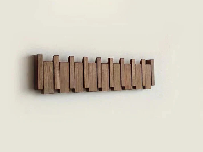 Wall mounted coat rack with foldable hooks in a modern wooden design featuring a natural finish, ideal for organizing coats and accessories in entryways or hallways 6