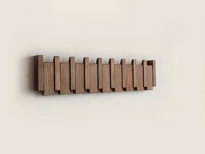 Wall mounted coat rack with foldable hooks in a modern wooden design featuring a natural finish, ideal for organizing coats and accessories in entryways or hallways 6