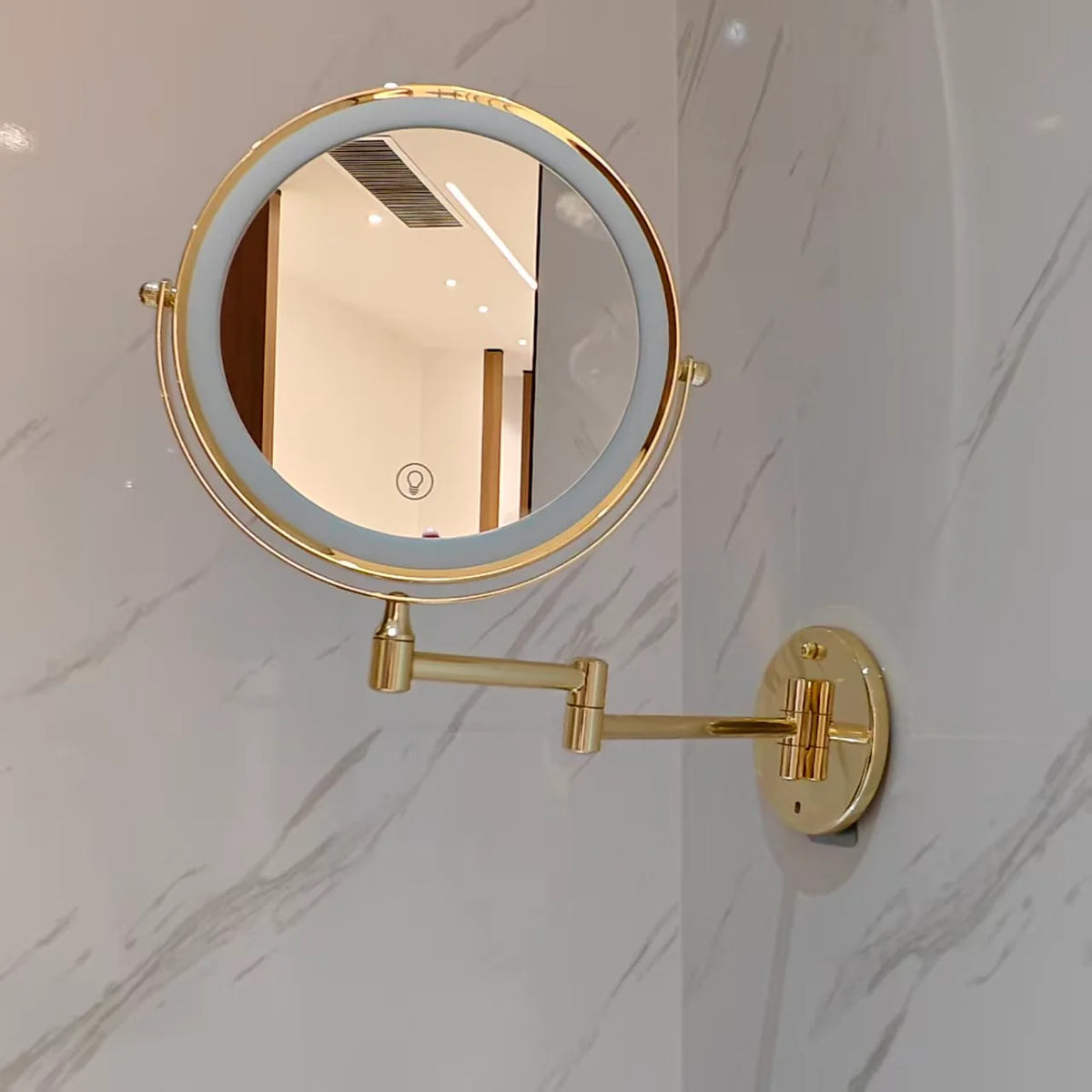 Wall mounted makeup mirror with LED light and magnification in a gold stainless steel finish, perfect for enhancing your beauty routine. 5