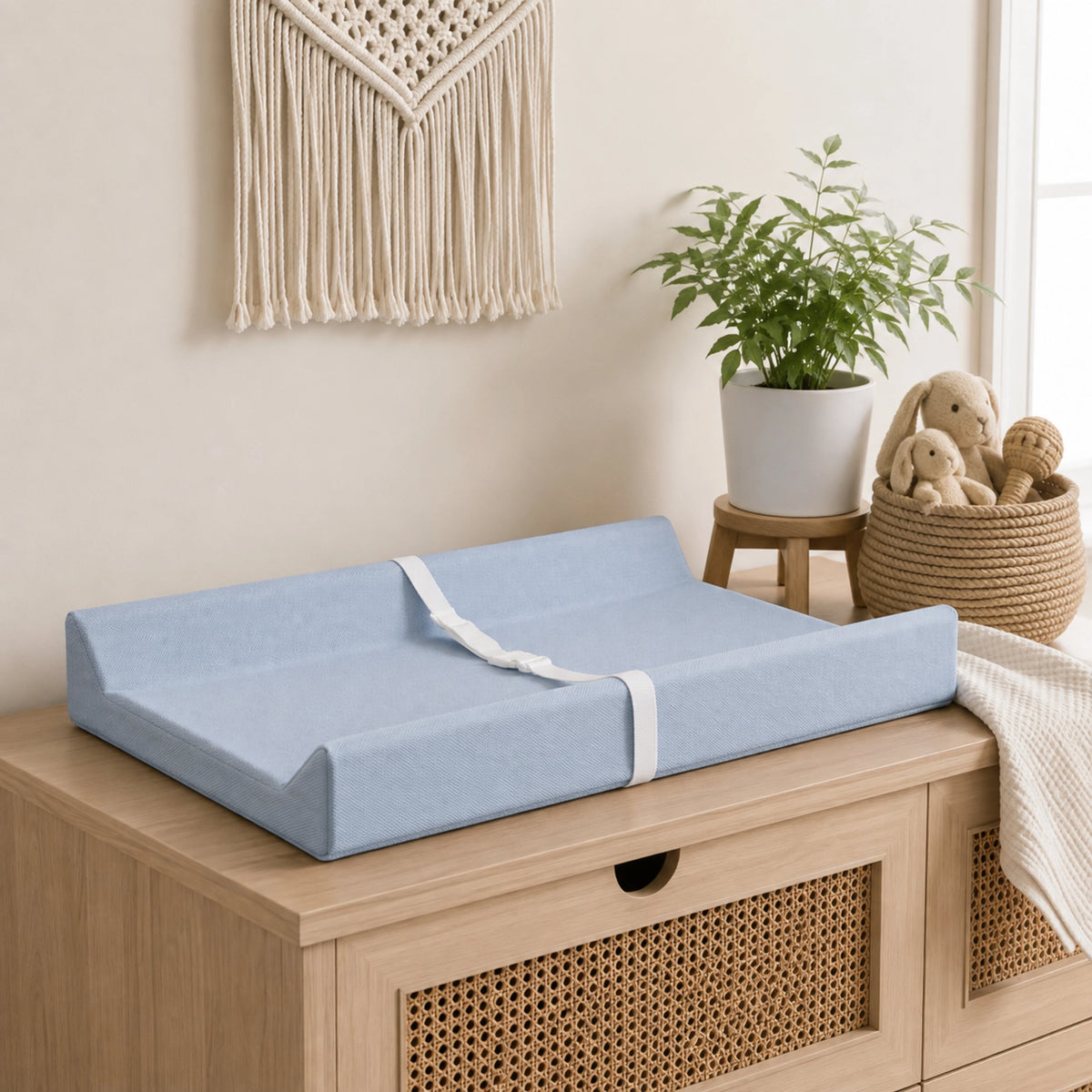 Waterproof baby changing pad with cushioned contoured support, featuring a neutral design ideal for modern nurseries. 10