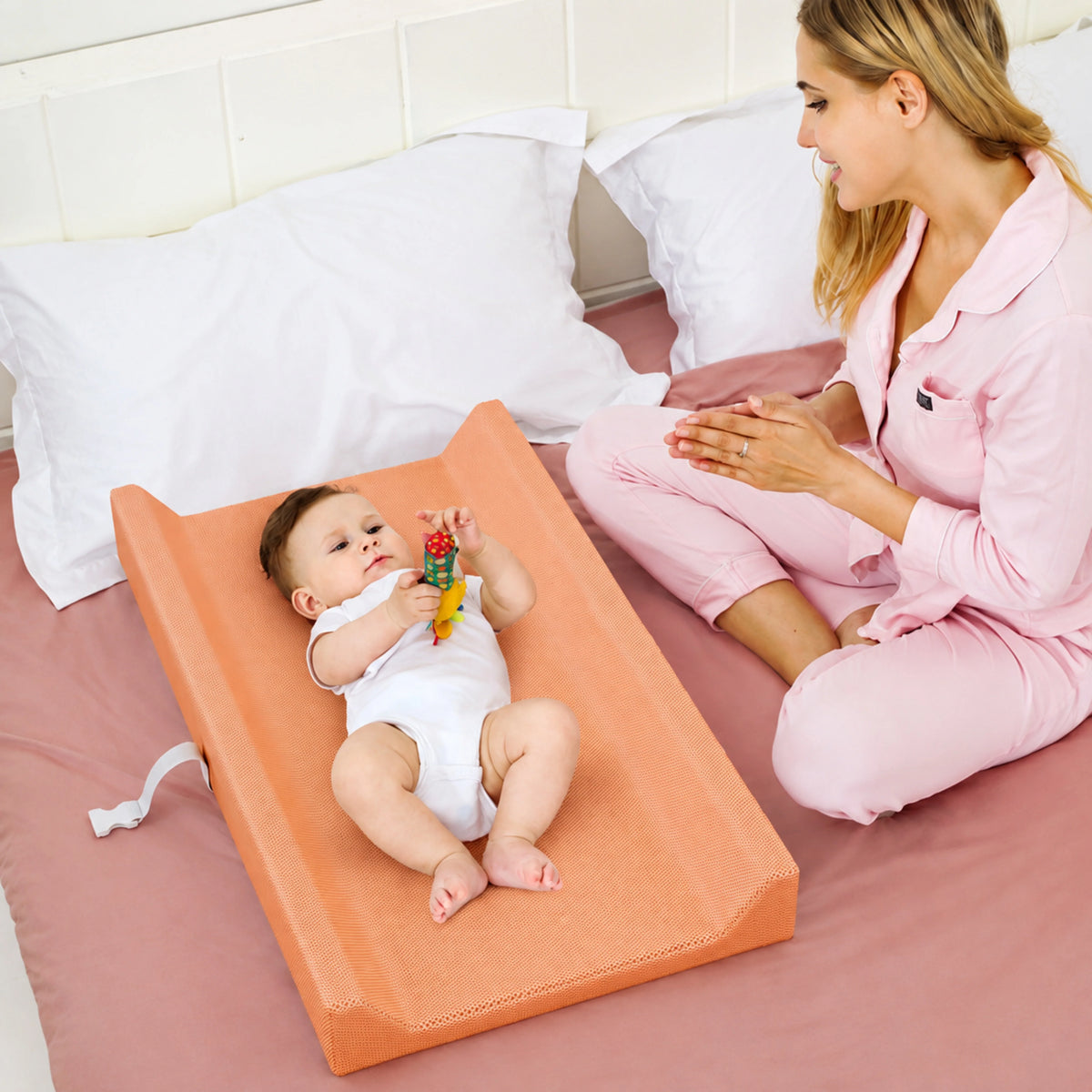 Waterproof baby changing pad with cushioned contoured support, featuring a neutral design ideal for modern nurseries. 5