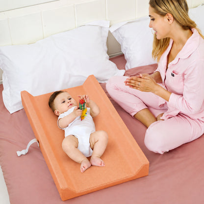 Waterproof baby changing pad with cushioned contoured support, featuring a neutral design ideal for modern nurseries. 5