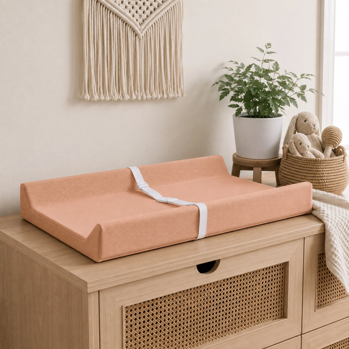 Waterproof baby changing pad with cushioned contoured support, featuring a neutral design ideal for modern nurseries. 9