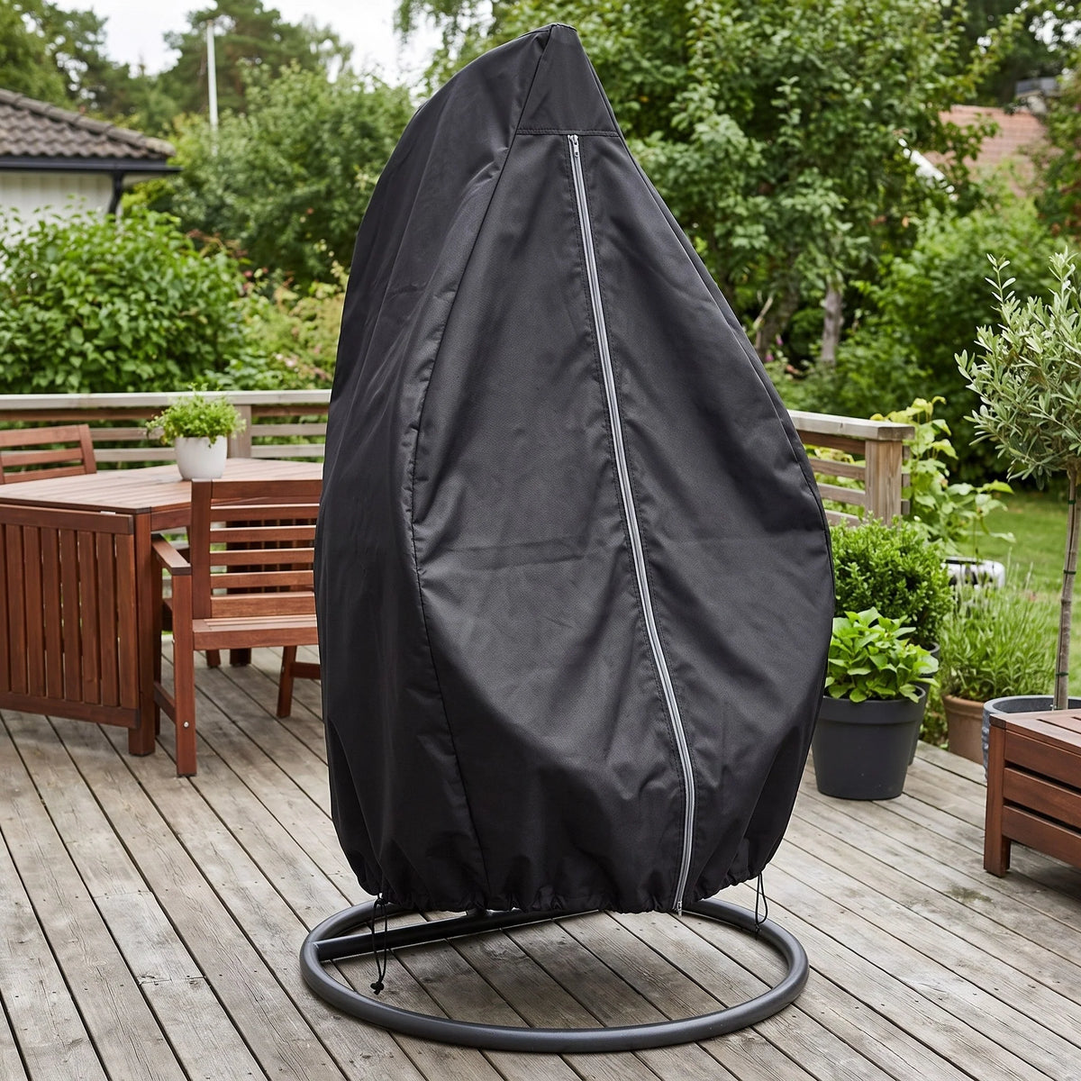 Waterproof hanging egg chair cover in black, made from durable Oxford fabric with UV protection and a secure drawstring closure, designed to protect outdoor furniture from 0