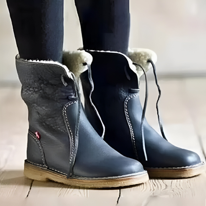 Waterproof winter boots for women featuring a cozy fur-lined interior and a convenient slip-on design, perfect for cold weather protection and comfort. 1