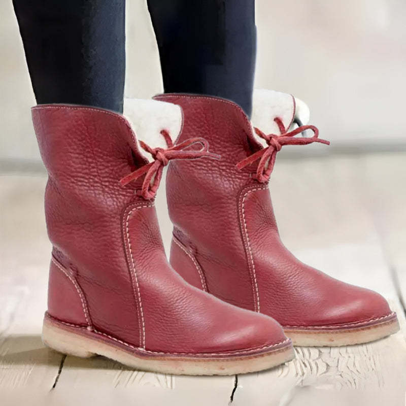 Waterproof winter boots for women featuring a cozy fur-lined interior and a convenient slip-on design, perfect for cold weather protection and comfort. 10