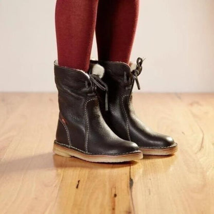 Waterproof winter boots for women featuring a cozy fur-lined interior and a convenient slip-on design, perfect for cold weather protection and comfort. 3