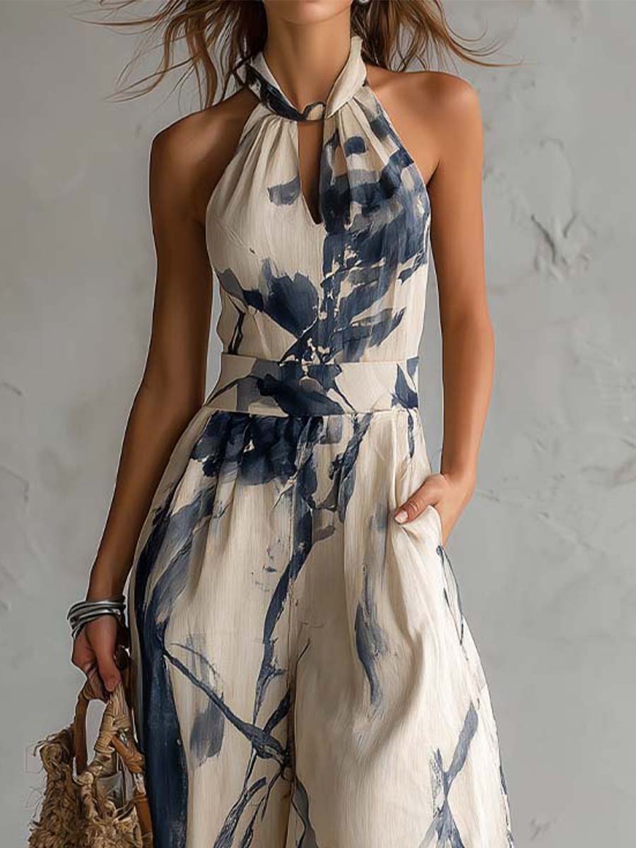 Wide-leg jumpsuit for women featuring a stylish halter neckline and convenient side pockets, designed in a bohemian ink wash print. 3