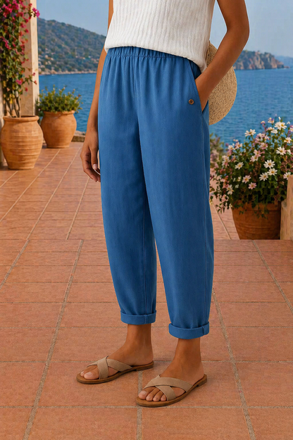 Wide leg linen pants for women featuring a comfortable waistband, designed for lightweight breathability, perfect for beach outings in white. 2