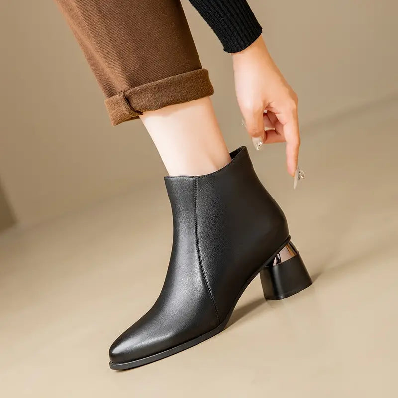 Women's ankle boots featuring a sleek black design and supportive sole, perfect for everyday comfort and style. 0