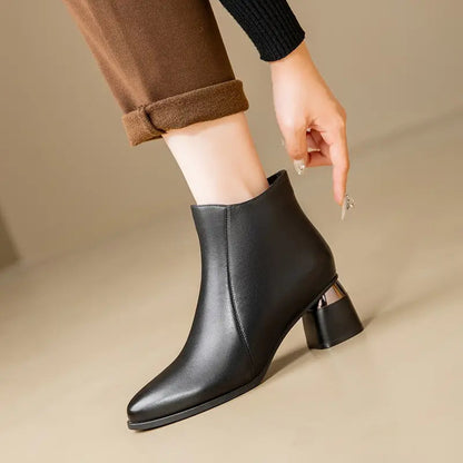 Women's ankle boots featuring a sleek black design and supportive sole, perfect for everyday comfort and style. 0