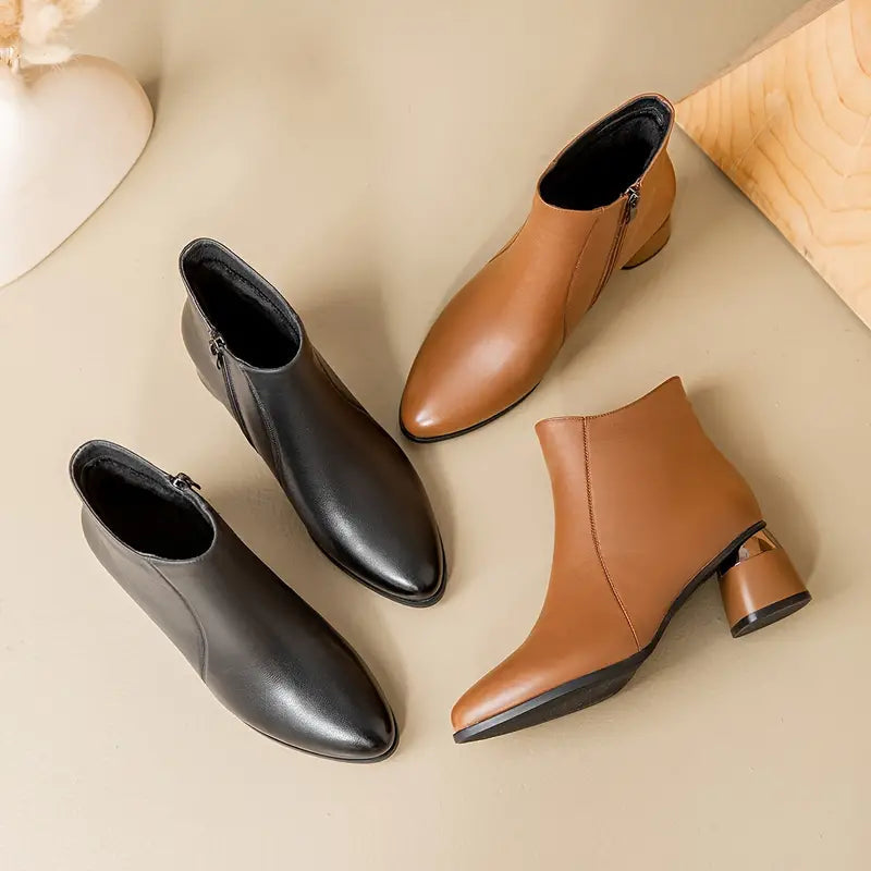 Women's ankle boots featuring a sleek black design and supportive sole, perfect for everyday comfort and style. 3