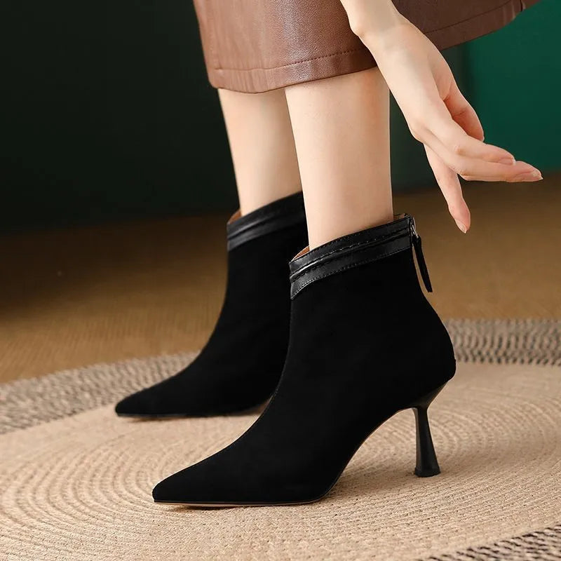 Women's black ankle boots featuring a supportive sole and a sleek comfort design, perfect for everyday wear. 0