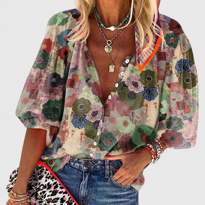 Women's floral print blouse with V-neck and long sleeves, featuring a relaxed fit ideal for casual or semi-formal wear. 0