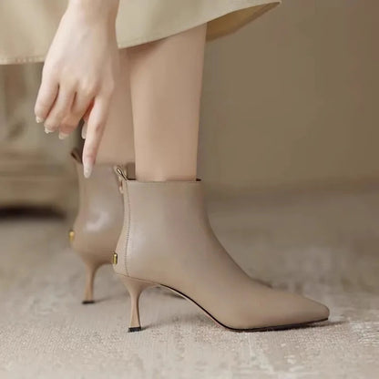 Elegant black women's boots featuring a slender kitten heel and pointed toe, designed for all-day comfort and style. 5