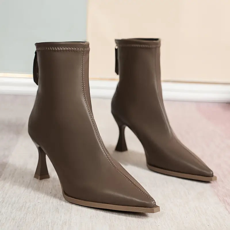 Elegant black women's boots featuring a slender kitten heel and pointed toe, designed for all-day comfort and style. 6