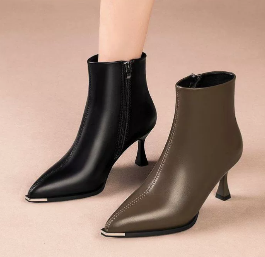 Elegant black women's boots featuring a slender kitten heel and pointed toe, designed for all-day comfort and style. 7