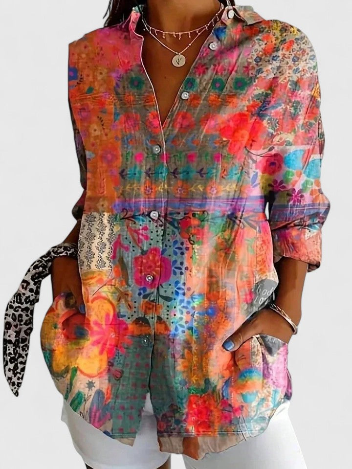 Women's button-up blouse featuring an artistic print, designed for versatility and elegance, perfect for both casual and formal occasions. 1