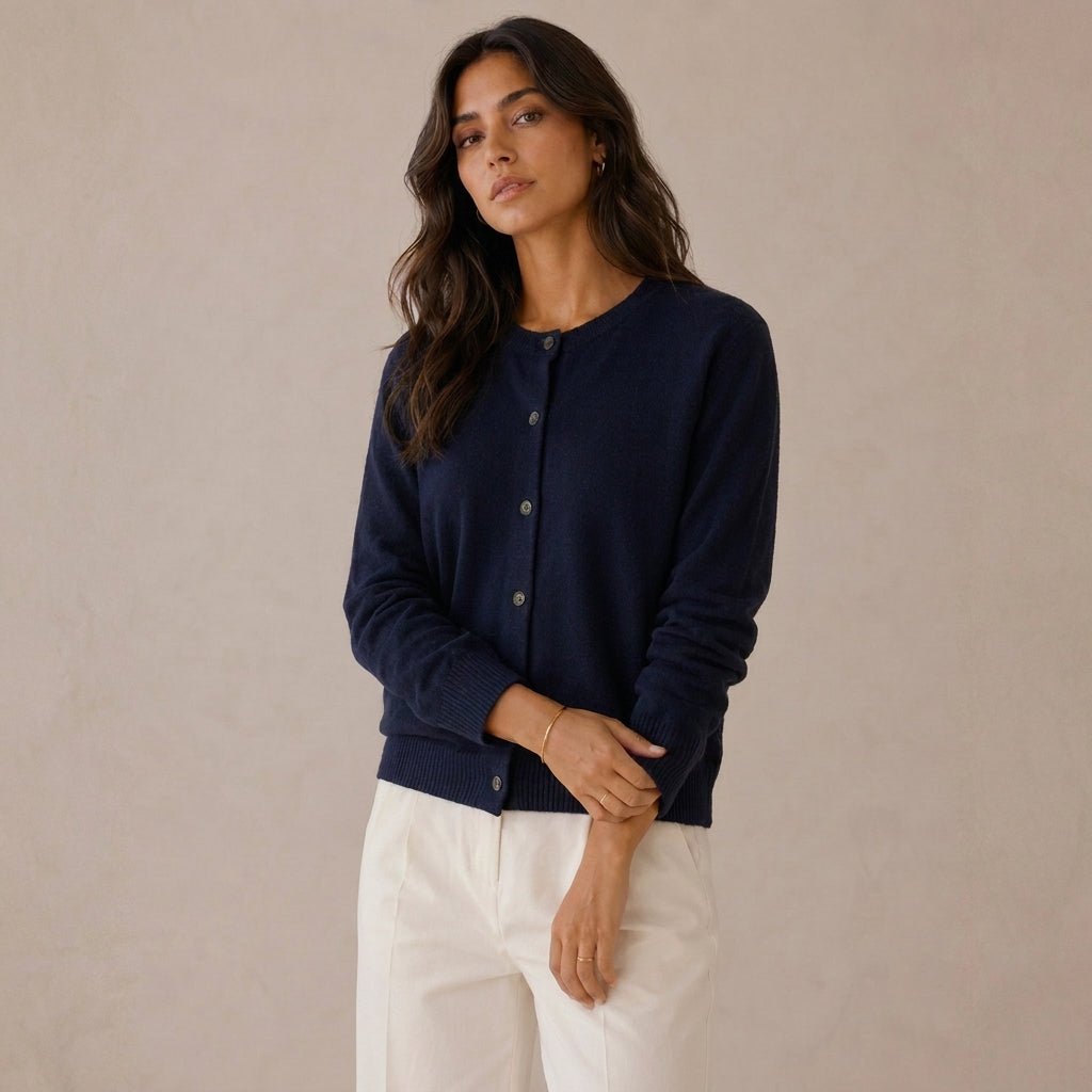 Women's cashmere cardigan featuring a button front and round neck, designed in a fitted style for versatile layering, perfect for both casual and formal occasions. 2