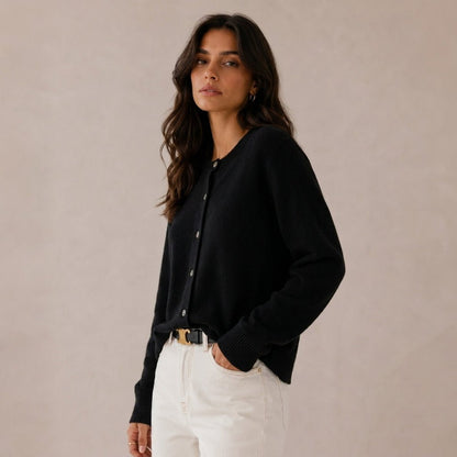 Women's cashmere cardigan featuring a button front and round neck, designed in a fitted style for versatile layering, perfect for both casual and formal occasions. 3