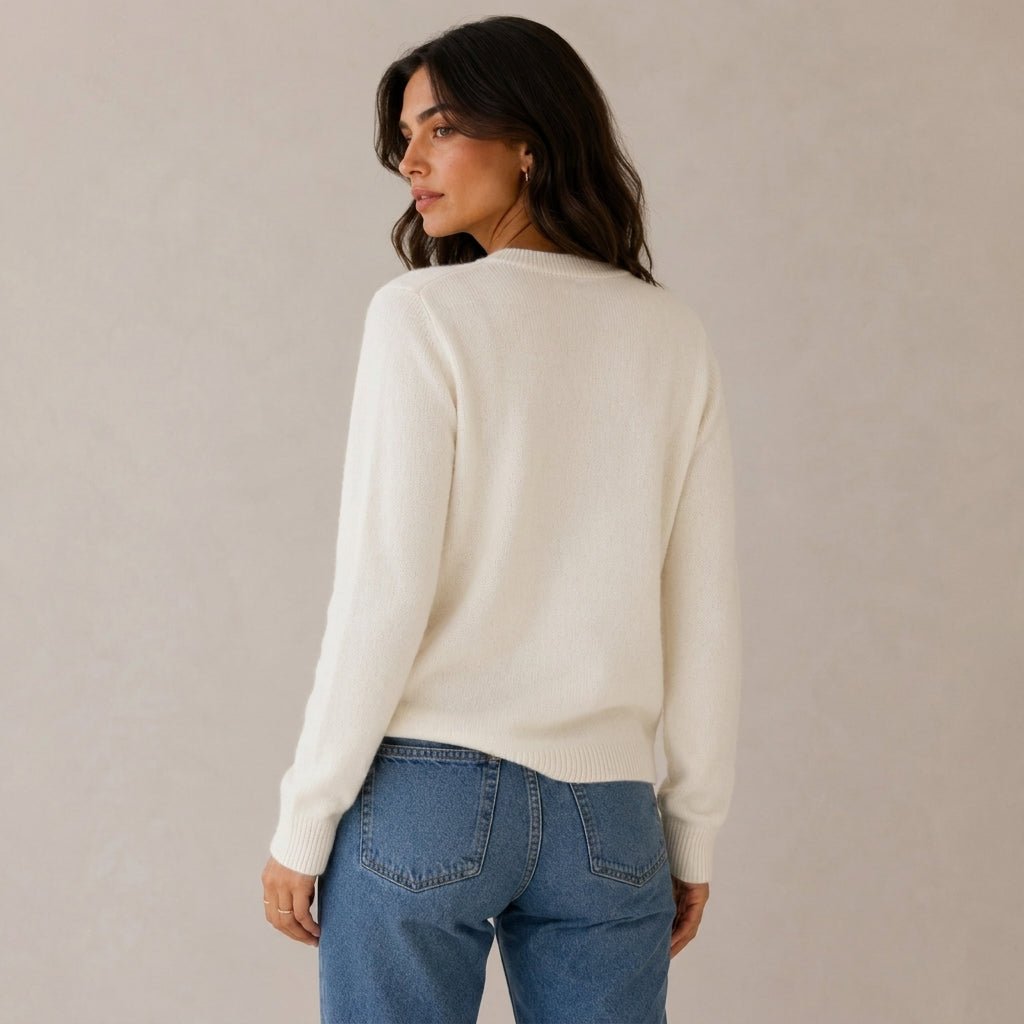 Women's cashmere cardigan featuring a button front and round neck, designed in a fitted style for versatile layering, perfect for both casual and formal occasions. 4