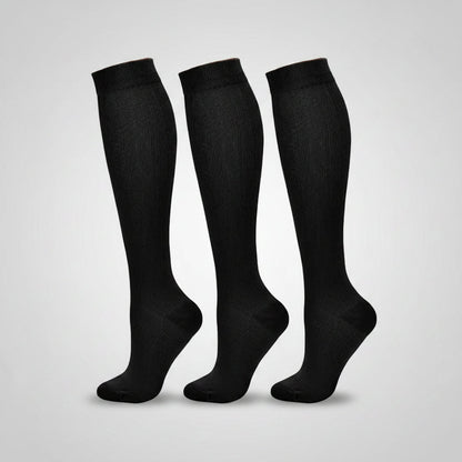 Women's compression socks designed for travel, featuring graduated support for enhanced circulation, breathable fabric for comfort, and a stylish design suitable for all-day wear. 1