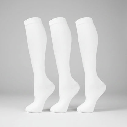 Women's compression socks designed for travel, featuring graduated support for enhanced circulation, breathable fabric for comfort, and a stylish design suitable for all-day wear. 2