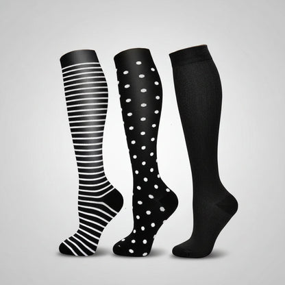Women's compression socks designed for travel, featuring graduated support for enhanced circulation, breathable fabric for comfort, and a stylish design suitable for all-day wear. 4