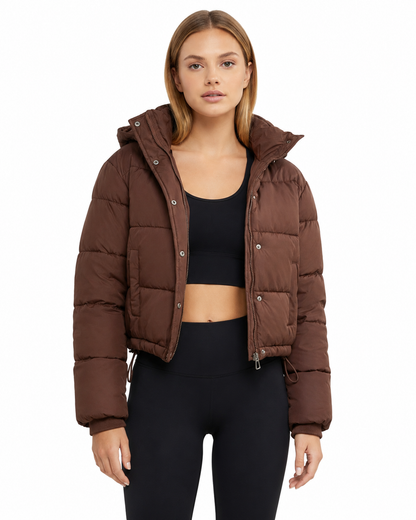 Women's cropped hooded puffer jacket featuring a zip closure and quilted insulated design, perfect for winter warmth and style. 0