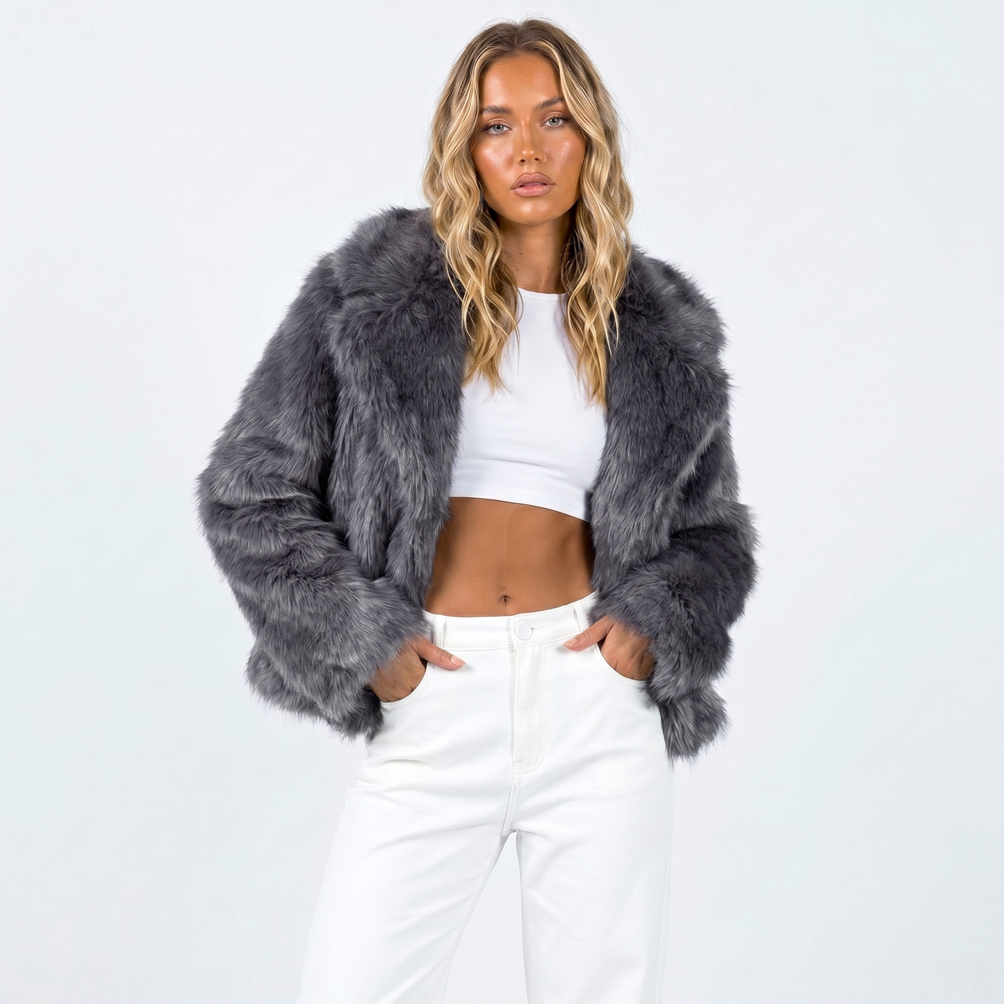 Women's faux fur jacket featuring an oversized collar, designed as a cropped winter coat suitable for casual and evening wear. 2