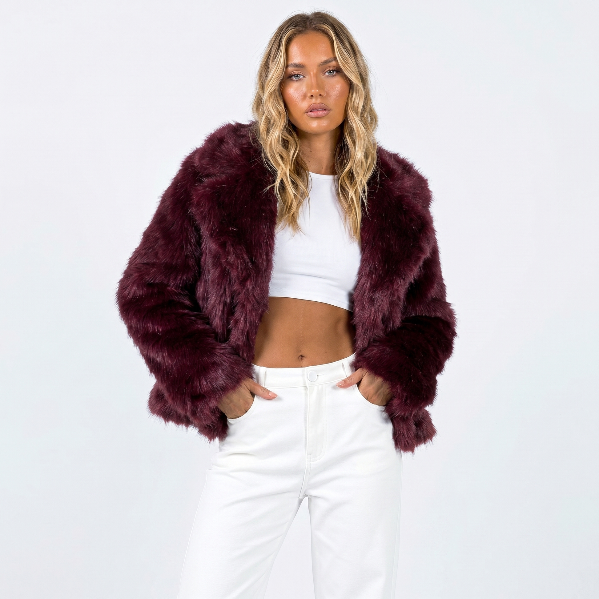 Women's faux fur jacket featuring an oversized collar, designed as a cropped winter coat suitable for casual and evening wear. 7
