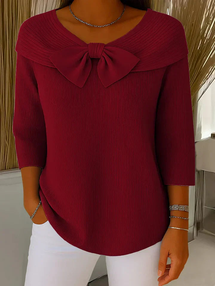 Women's fitted sweater with bow detail in soft fabric, featuring a cozy minimalist design perfect for an elegant autumn style. 3