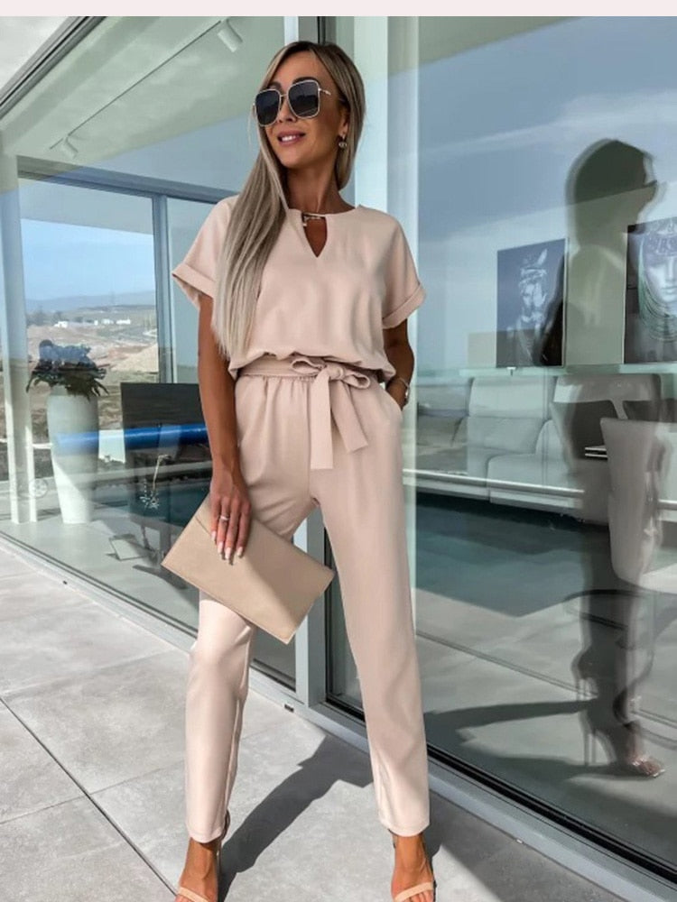 Women's elegant black jumpsuit featuring a flattering V-neckline and comfortable elastic waistband, perfect for transitioning from day to night. 6