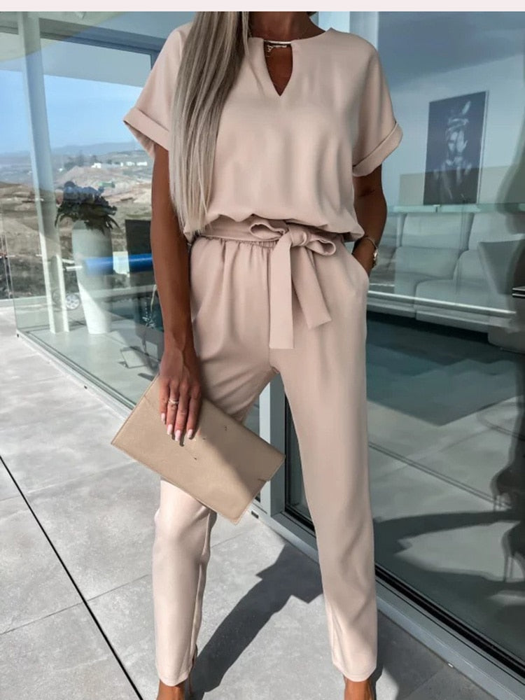 Women's elegant black jumpsuit featuring a flattering V-neckline and comfortable elastic waistband, perfect for transitioning from day to night. 7
