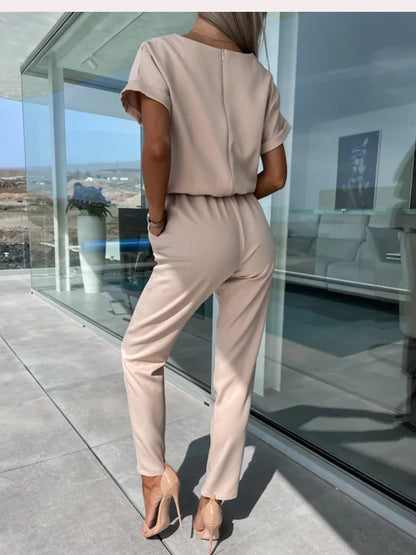 Women's elegant black jumpsuit featuring a flattering V-neckline and comfortable elastic waistband, perfect for transitioning from day to night. 8