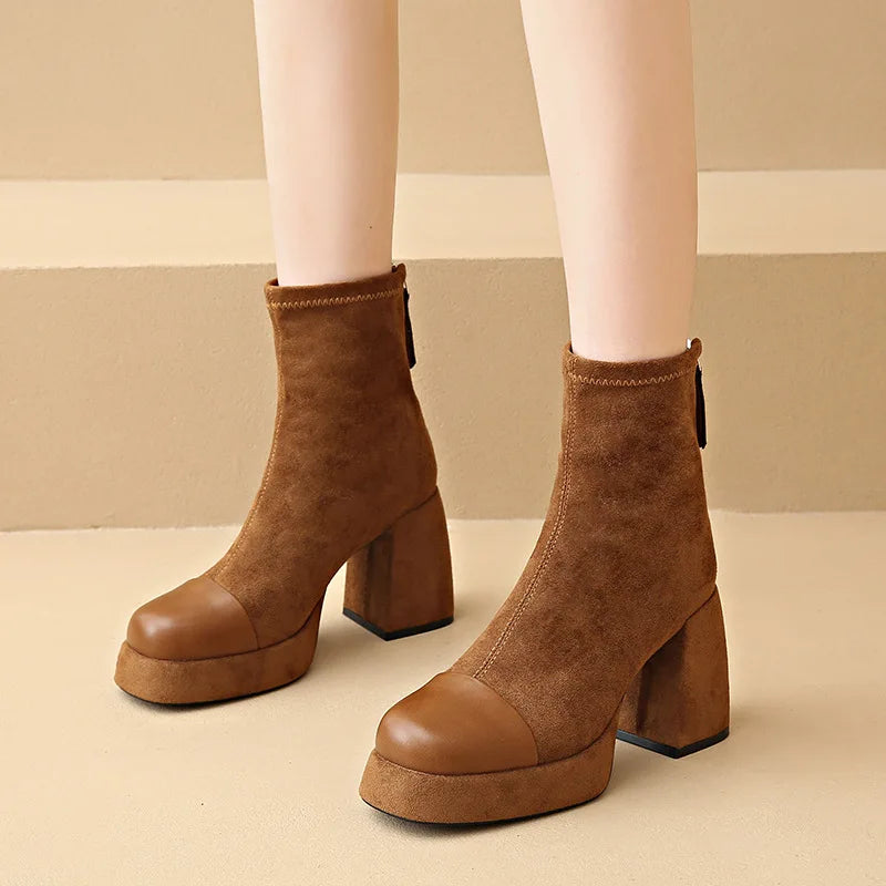 Stylish women's black knee high boots featuring a supportive sole and elegant sculpted design, perfect for fashion-forward outfits. 1