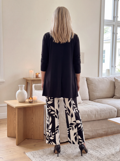 Women's loungewear set featuring a longline top and printed trousers, crafted from soft breathable fabric for ultimate casual comfort. 1