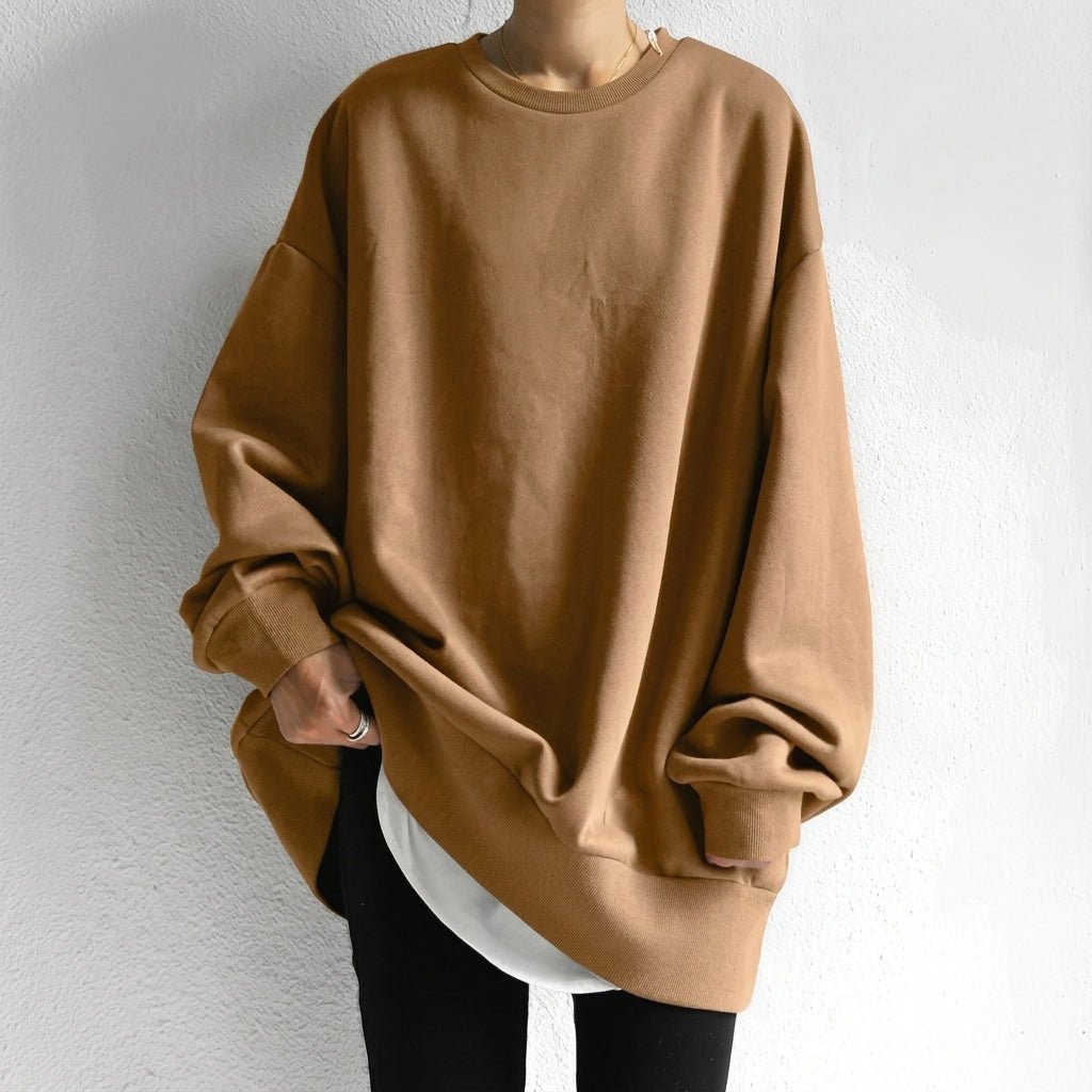 Women's oversized sweater tunic featuring long sleeves and a cozy drop shoulder design, perfect for casual comfort and stylish layering. 1