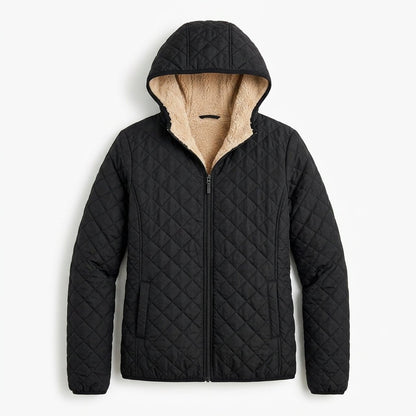 Women's quilted jacket featuring a fleece-lined hood and zip-up closure, designed for warmth and style, perfect for winter wear. 1