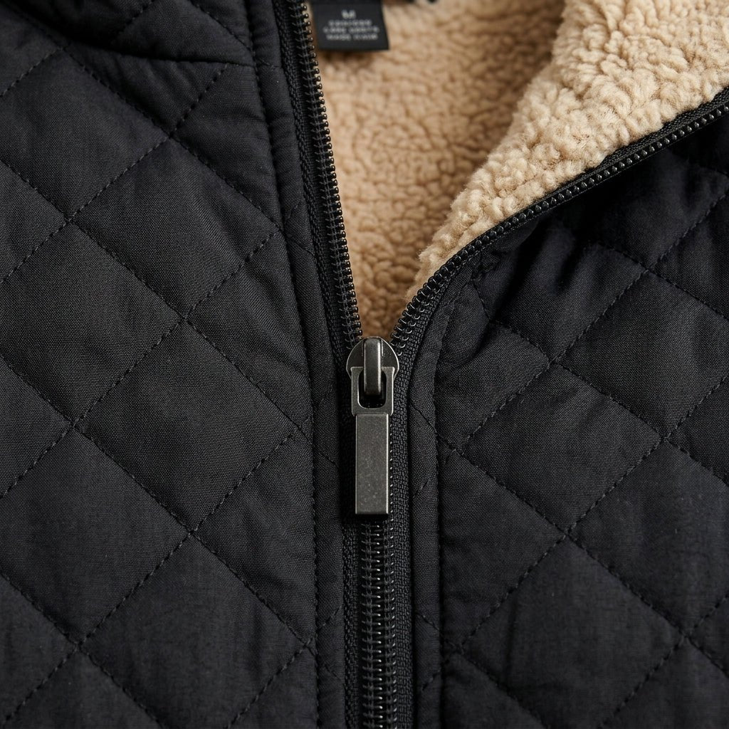 Women's quilted jacket featuring a fleece-lined hood and zip-up closure, designed for warmth and style, perfect for winter wear. 2