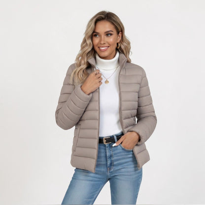 Women's lightweight quilted jacket in a slim fit, featuring a stylish neutral tone, perfect for casual outings and versatile layering. 0