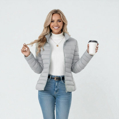 Women's lightweight quilted jacket in a slim fit, featuring a stylish neutral tone, perfect for casual outings and versatile layering. 6