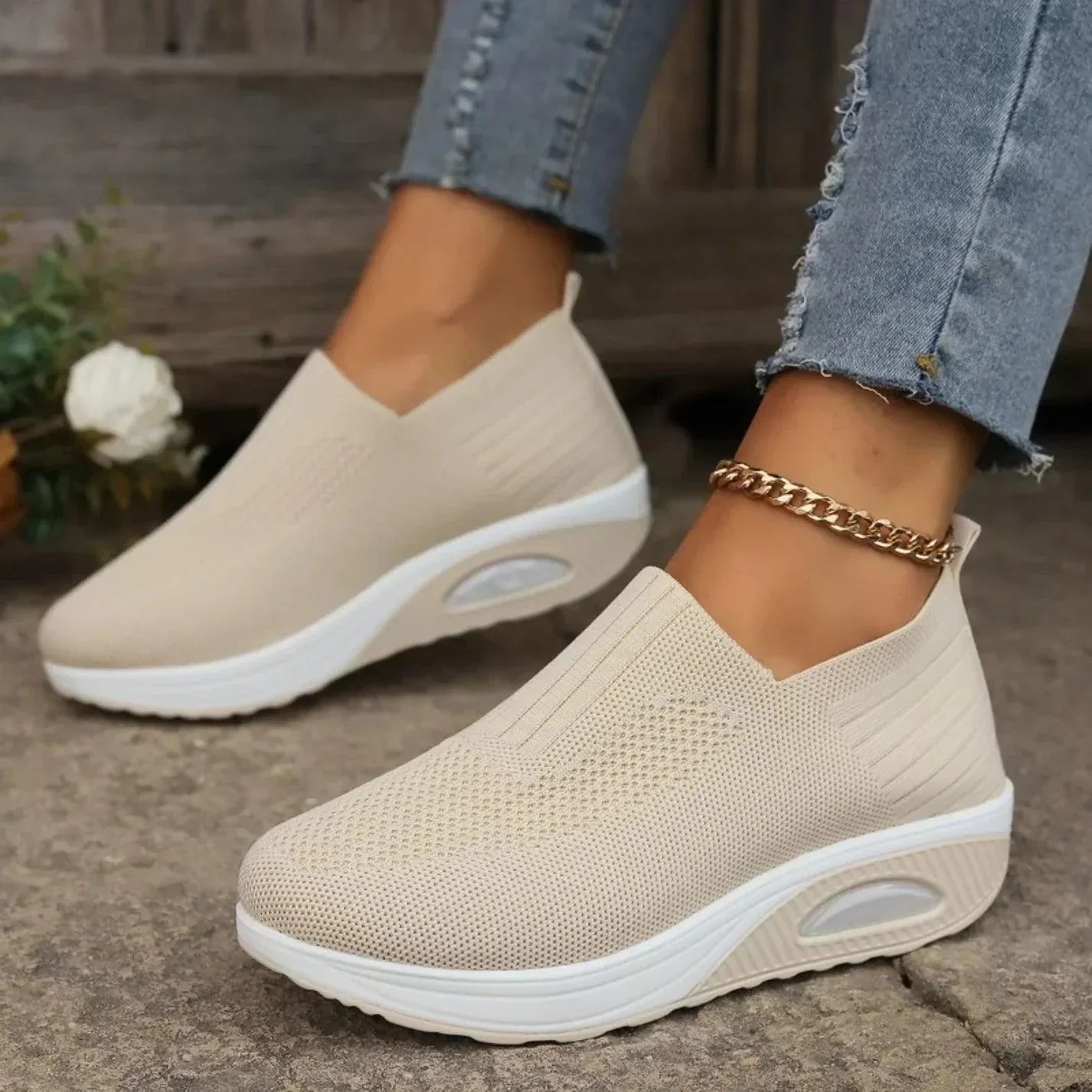 Women's slip-on sneakers in white, featuring a breathable design and flexible support, perfect for sporty minimalist style. 2