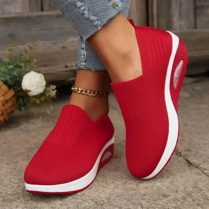 Women's slip-on sneakers in white, featuring a breathable design and flexible support, perfect for sporty minimalist style. 5