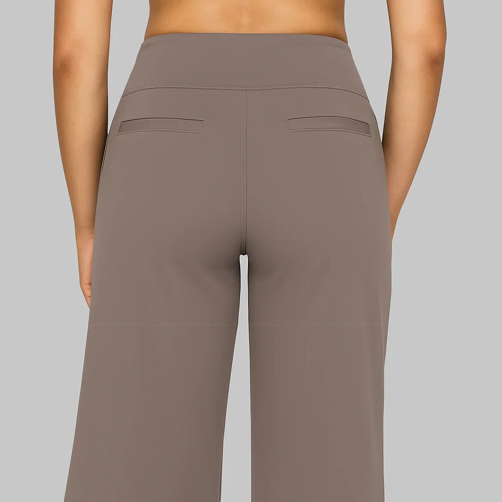 Women's stretch pants featuring a high waist design and deep pockets, crafted for comfort with wrinkle-free fabric, perfect for casual outings and workouts. 1