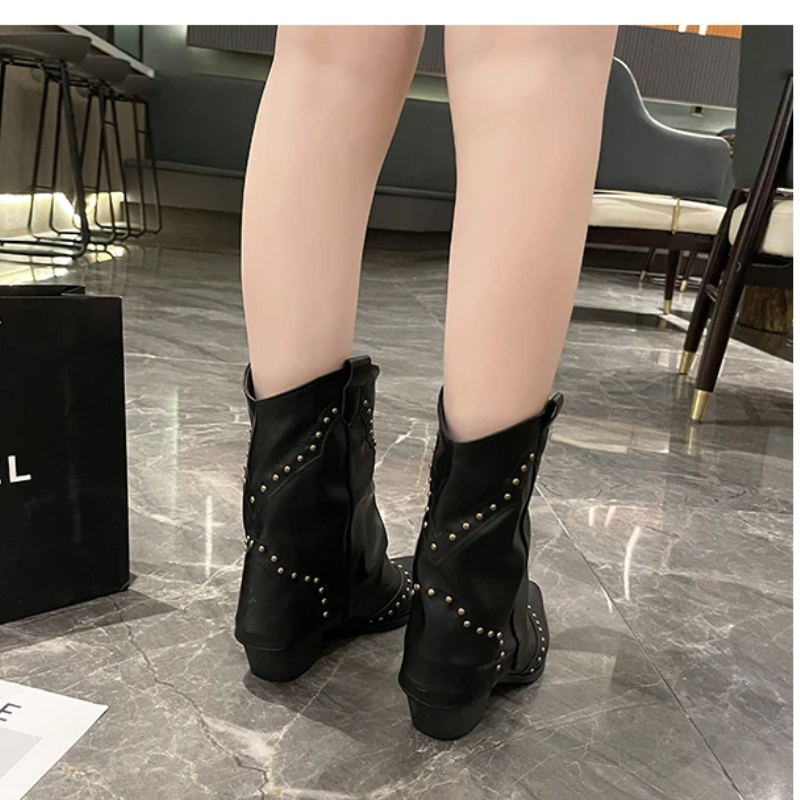Black women's studded cowboy boots featuring mid-heel and metallic accents, showcasing a stylish Western-inspired design perfect for fashionable outfits. 7