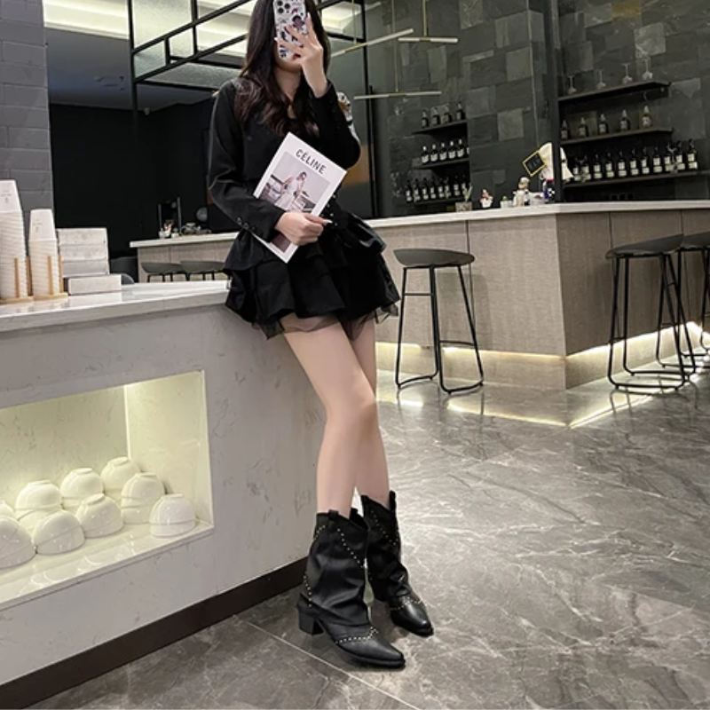 Black women's studded cowboy boots featuring mid-heel and metallic accents, showcasing a stylish Western-inspired design perfect for fashionable outfits. 8