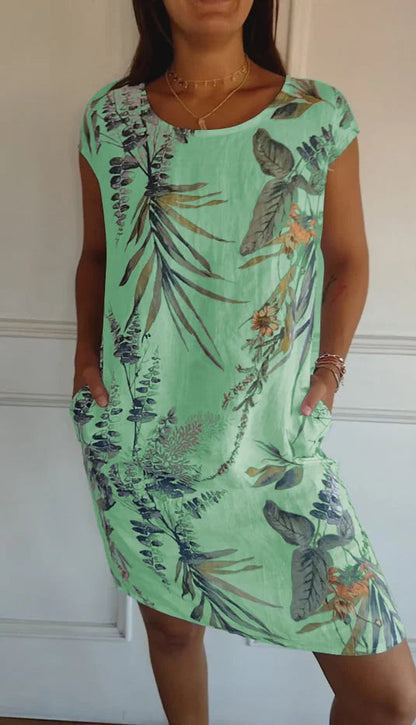 Women's summer dress featuring a vibrant botanical print, designed with convenient pockets, made from a lightweight cotton-linen blend for a relaxed fit, perfect for warm 5